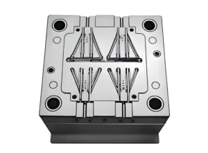 Metal mold used for injection molding with complex design features.