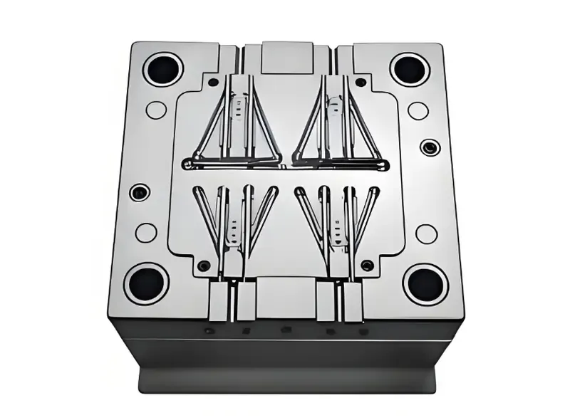 Metal mold used for injection molding with complex design features.