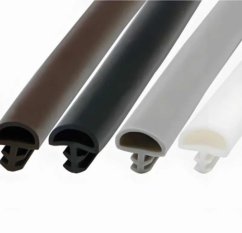 Um conjunto de extrusões de borracha coloridas em castanho, preto, cinzento e branco.