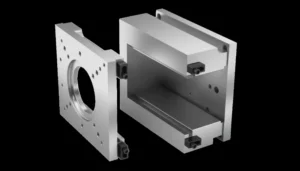 Two metal components of an injection mold separated, showing precision engineering and design.