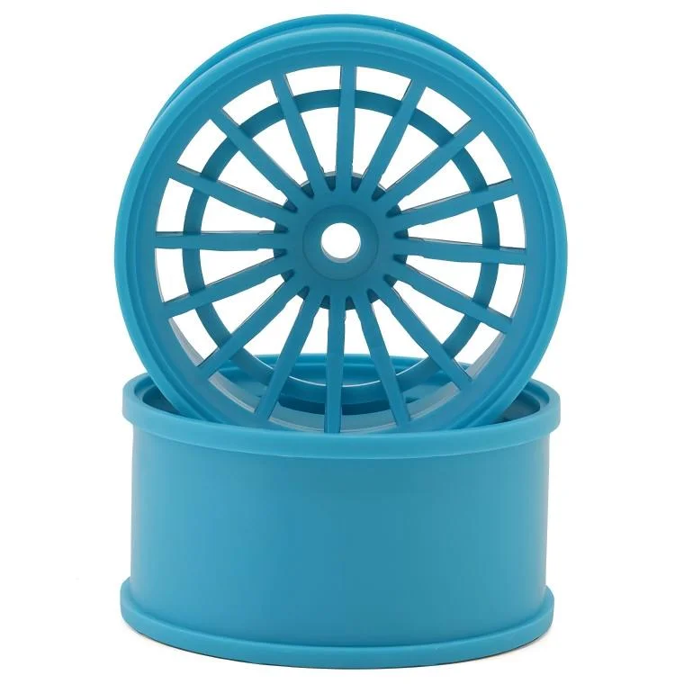 Blue plastic wheel rims with circular spoke design, ideal for toy or model cars.