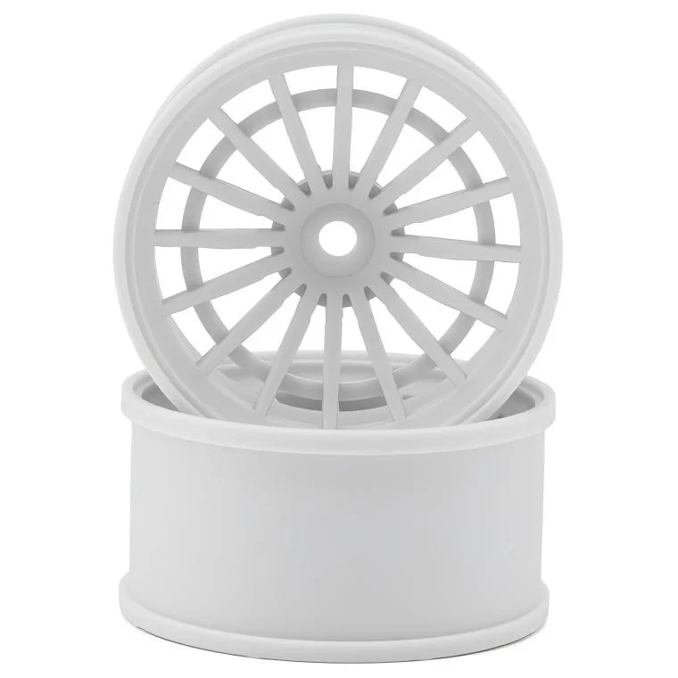 White plastic injection molded wheels with a spoke design, showcasing precision engineering.