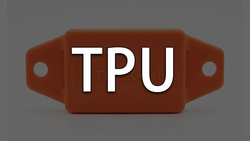 Orange TPU plastic device with two holes, rectangular shape.