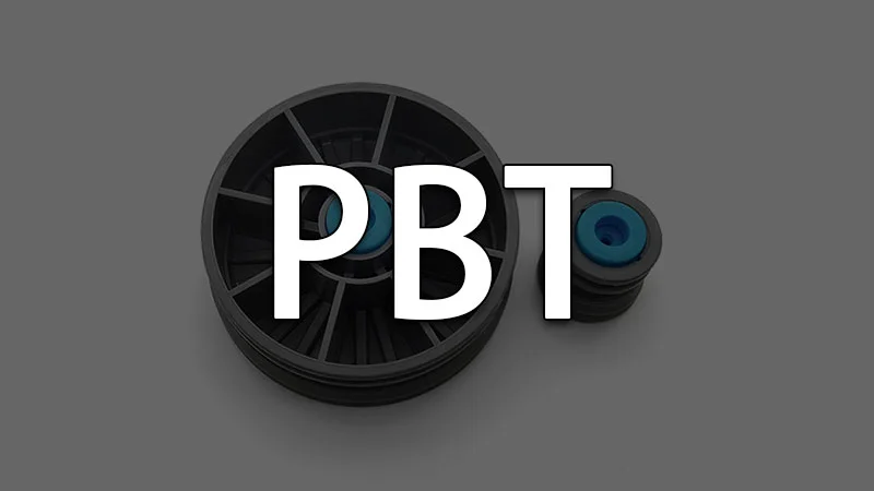Two PBT wheel components with central blue cores displayed side by side.