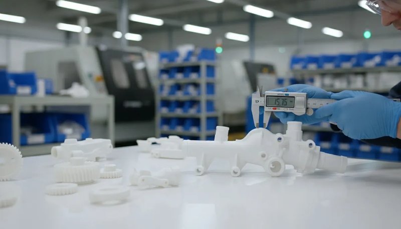 Quality inspection of injection molded parts using precision measuring instruments in a factory lab