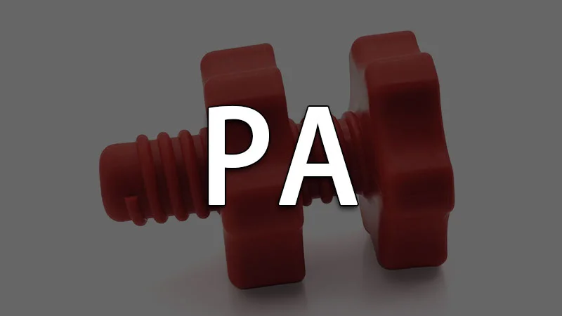 Red plastic screw with star-shaped head, labeled 'PA' for polyamide.