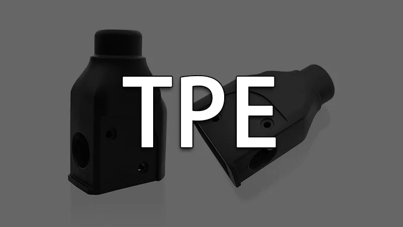 Two black TPE injection molded parts on a gray background.