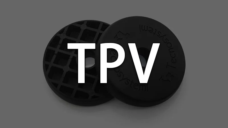 Two TPV rubber discs, one with a grid pattern and another with text imprinted, showcasing material properties.