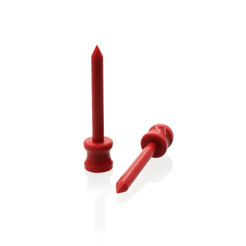 Two red plastic pins designed through injection molding, displayed on a white background.