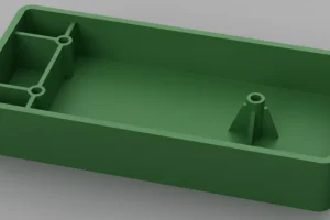 Green plastic box with a rectangular shape and internal supports shown in a 3D rendering on a gray background.