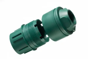 Two green plastic injection molded parts designed to fit together, showcasing precise engineering and manufacturing quality.