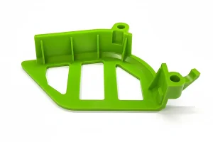 Green plastic injection molded part with a unique design and open spaces, showcasing intricate engineering.